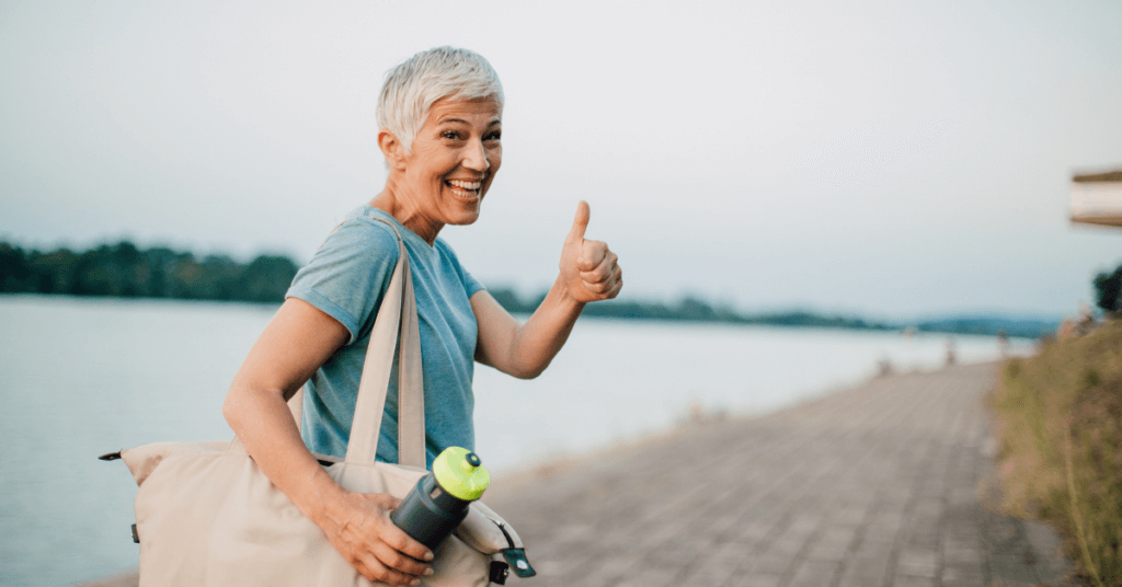 Woman giving thumbs up sign