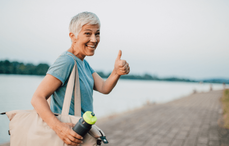 Woman giving thumbs up sign