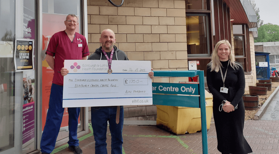Cheque presentation by a fundraiser with two NHS Lothian members of staff
