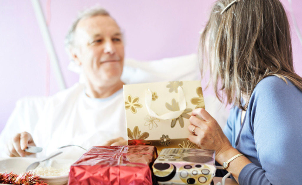 A patient in hospital receiving Christmas presents