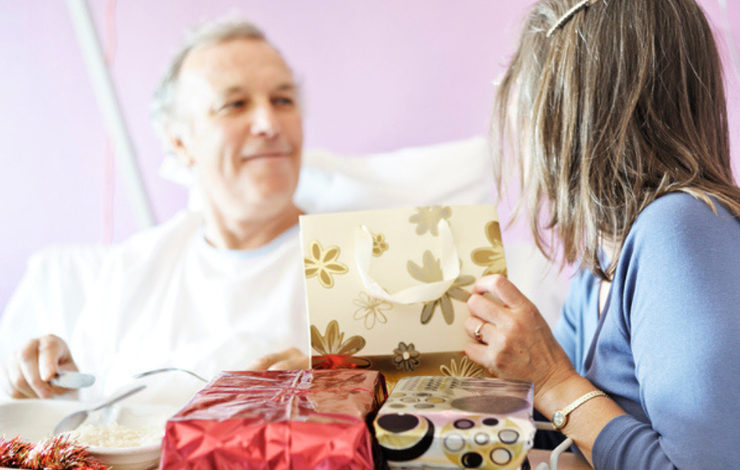 A patient in hospital receiving Christmas presents