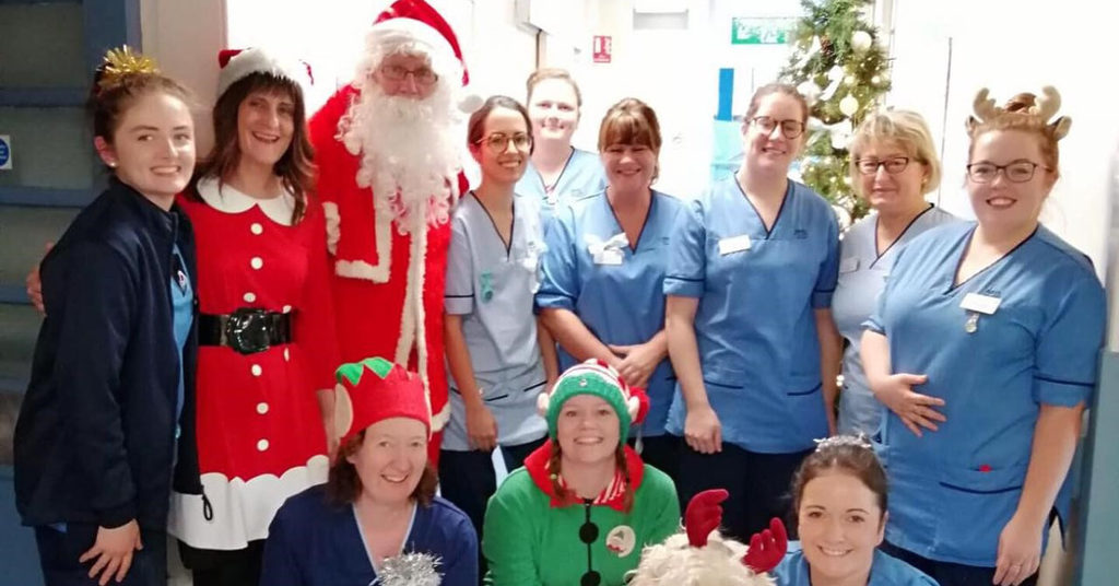 NHS staff with Santa Claus