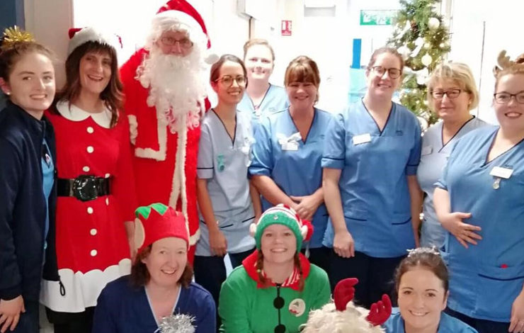 NHS staff with Santa Claus