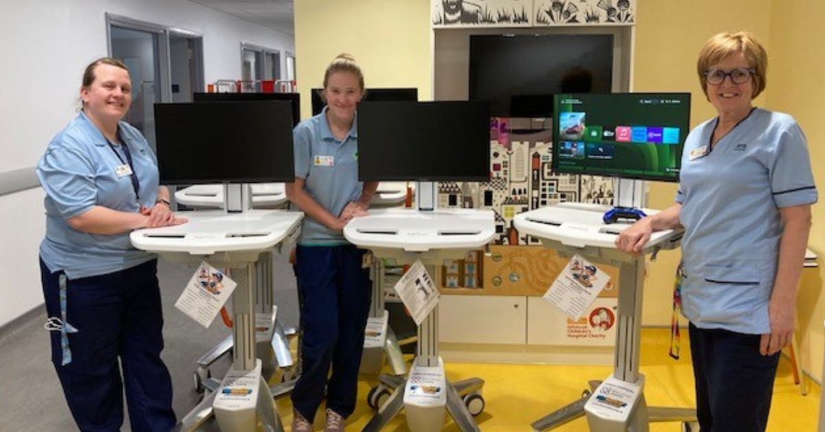 Play Specialists at the Royal Hospital for Children and Young People with Gaming Carts for patients