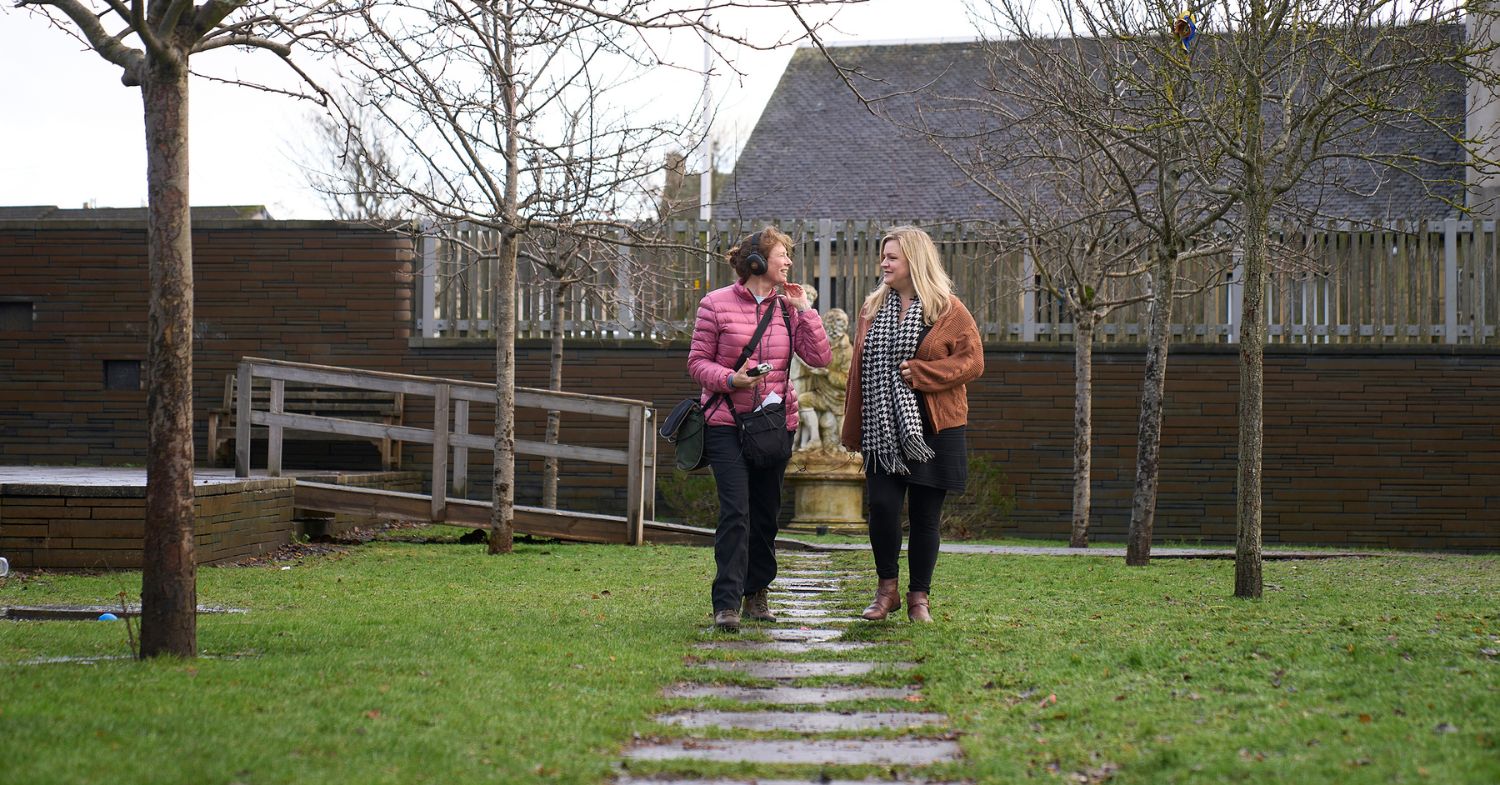 NHS Lothian staff member talking to writer and photographer Lottie Davies