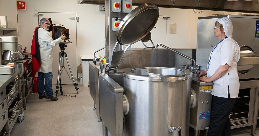 Filming an NHS Lothian member of staff in the kitchens where they work