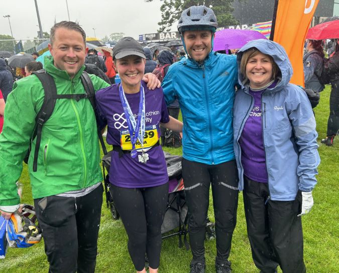 Ross and Fiona Matheson, their mum and Fiona's partner smiling at the camera after the Edinburgh Marathon Festival