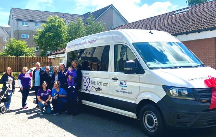 Teams from NHS Lothian Charity and Sunndach and Calareidh standing beside the new adapted minibuses