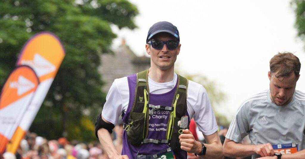 EMF runner, Neil, running past the crowds