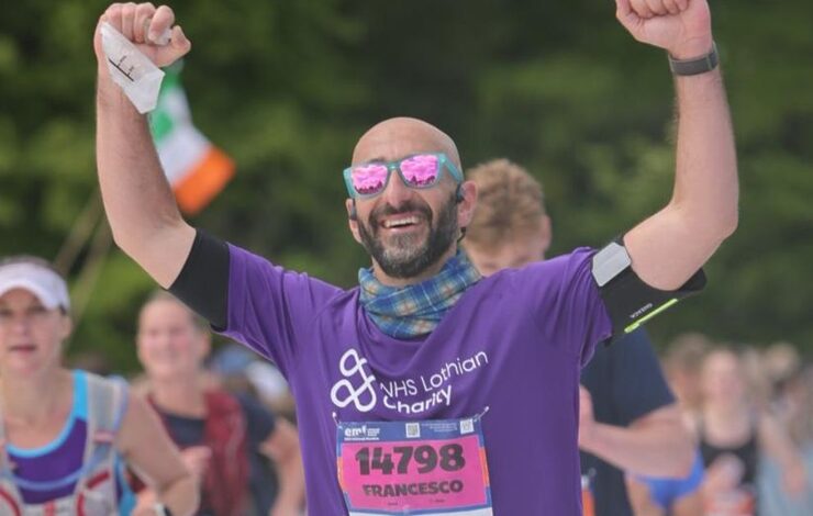An EMF participant, Francesco Pomponi running with his arms raised in celebration