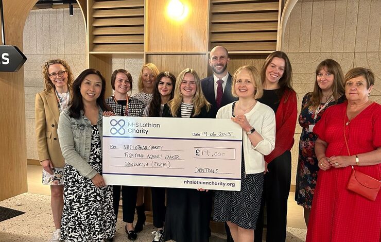 staff from Dentons presenting a cheque for £14,000 to NHS Lothian Charity