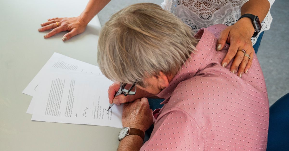 Husband and Wife signing their Will. Leaving their legacy behind.